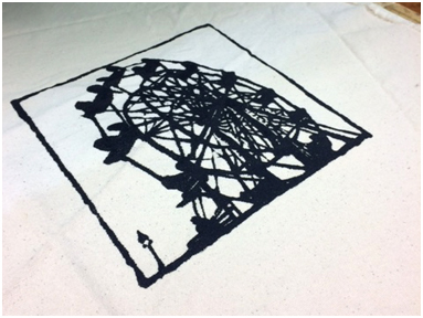 A ferris wheel print on cotton duck—textile ink & photo stencil.